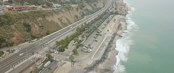 Overhead drone image showing PCH, parking lot and coastline at Capistrano Beach