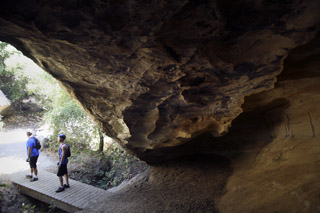 Two people stand in front of Robber's Cave