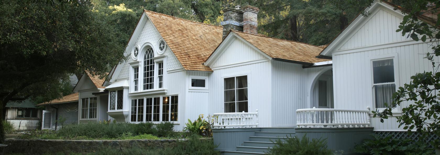 Historic white house in a wooded setting