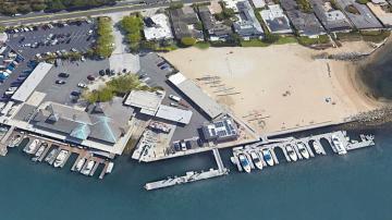 Aerial image of small beach and boat slips at Bayside Beach in Newport Harbor