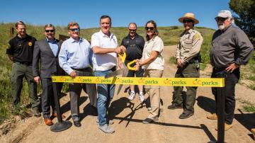 Donald P. Wagner, Chairman of the Orange County Board of Supervisors and OC Parks Interim Director Pam Passow cut the ribbon to commemorate the opening of  Saddleback Wilderness. 