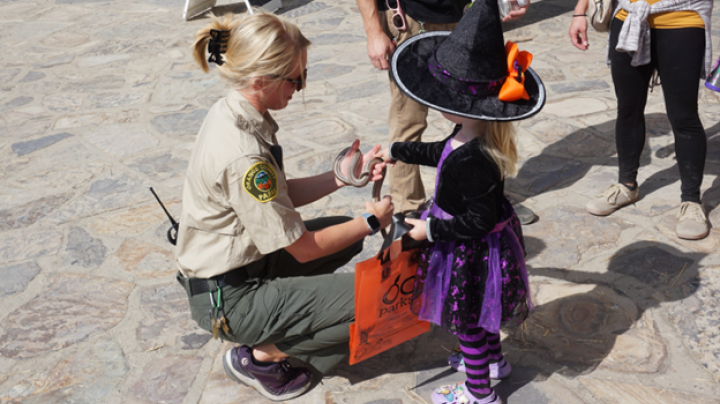 Resource specialist with snake and young girl