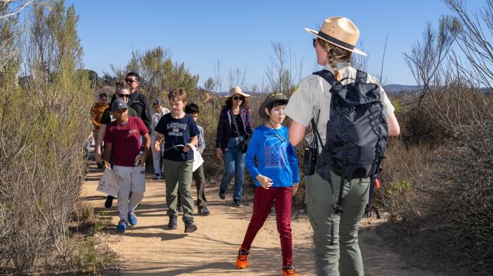 junior ranger program group going down the trail