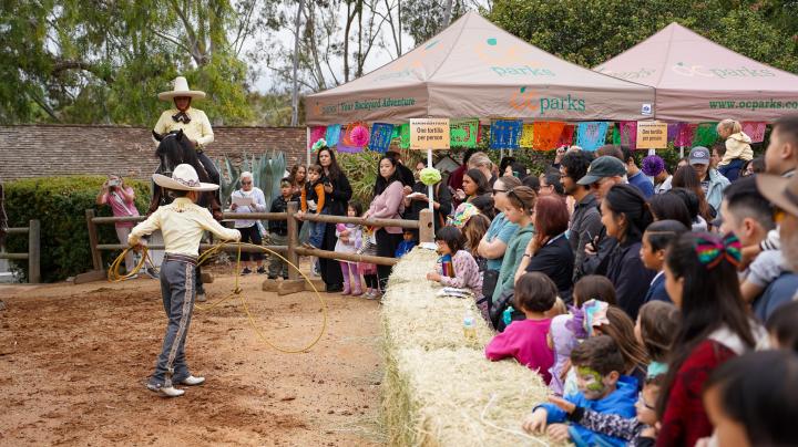 Attendees watch a charro horse roping demonstration at Rancho Days Fiesta at Heritage Hill Historical Park in Lake Forest.