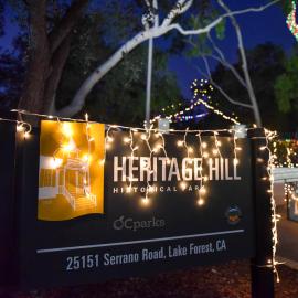 Holiday lights adorn sign at Heritage Hill Historical Park