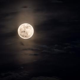 A full moon in a dark sky.