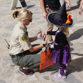 Resource specialist with snake and young girl
