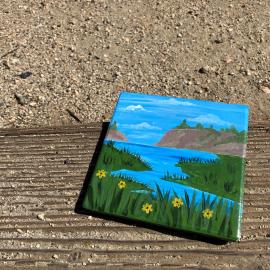 Picture of painted coaster laying on the ground