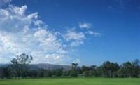 Carbon Canyon Regional Park grassy field with mostly sunny skies