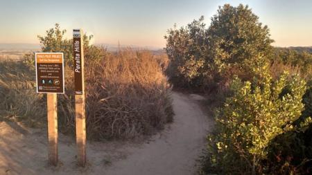 Trail project sign at trailhead