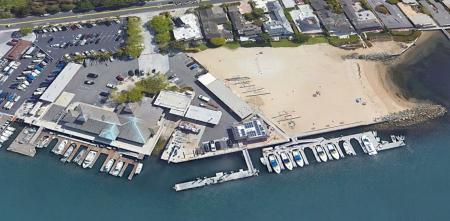 Aerial image of small beach and boat slips at Bayside Beach in Newport Harbor
